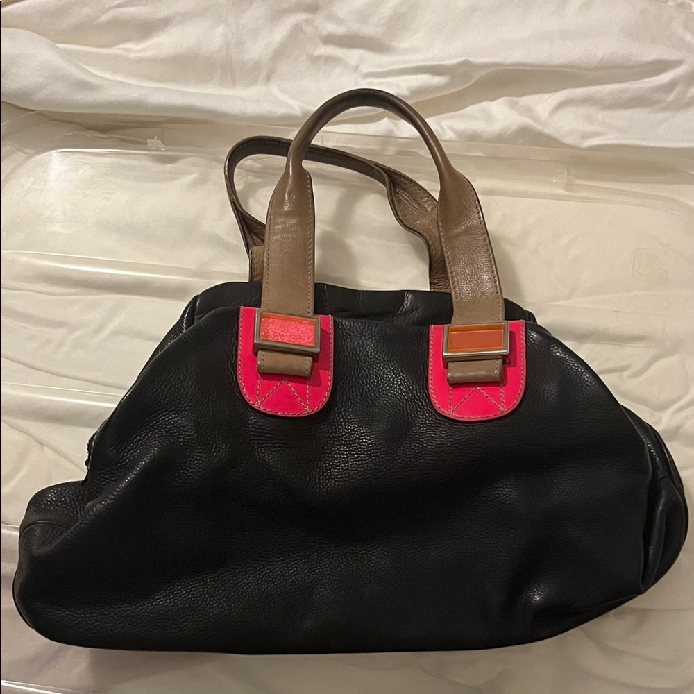 Meredith Wendell bag.
Elegant Black and Pink Shoulder Bag